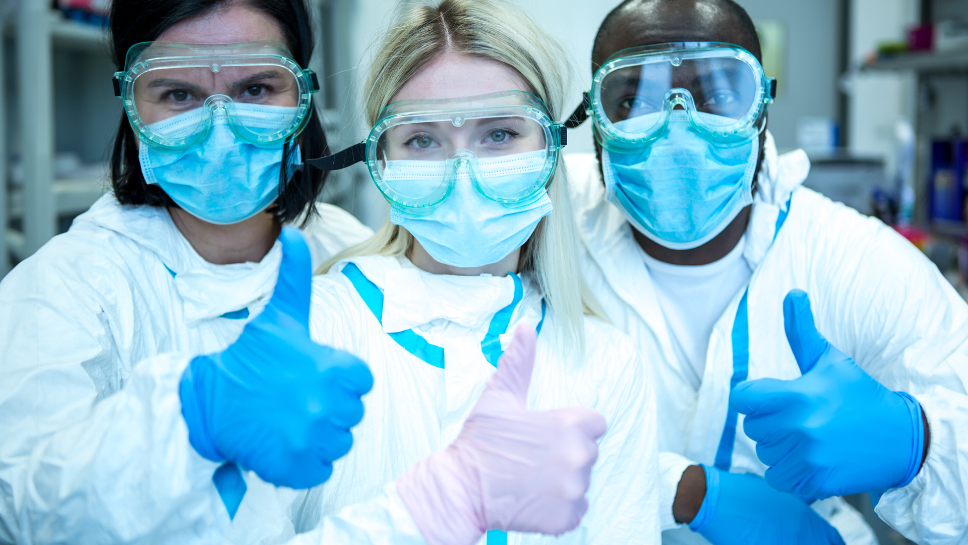 Scientists giving thumbs up